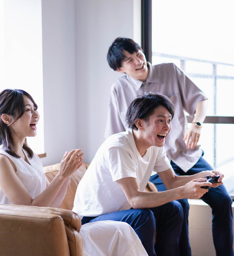 Friends enjoying a computer game together