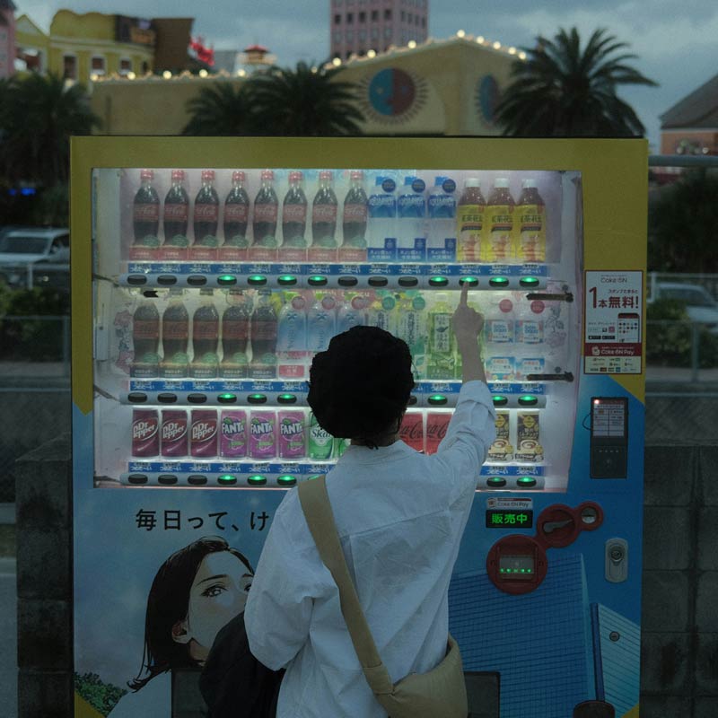 Woman using a vending machine in Japan - Photo by Daesun Kim on Unsplash