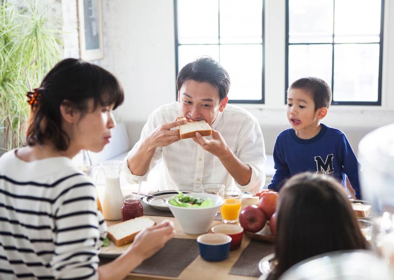 Japanese family enjoying breakfast together
