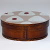 Dark wood bento box with painted lid