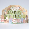 3D popup greetings card with Happy Birthday words and small birds, presents and cake design