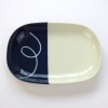 Oval Japanese ceramic plate with navy blue dipped glaze design