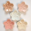Set of five 'sakura' chopstick rests