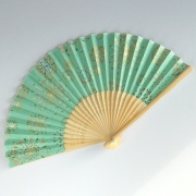 Japanese folding fan with fireworks design in pale green
