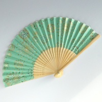 Japanese folding fan with fireworks design in pale green