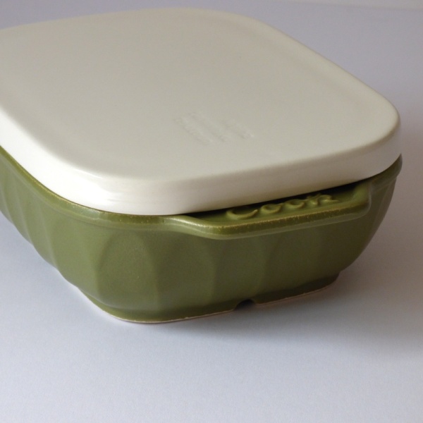 Handle detail of green ceramic oven dish