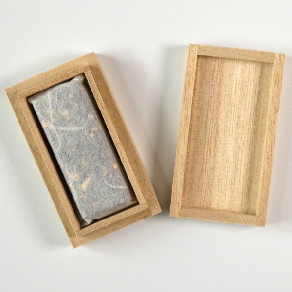 Solid sumi ink wrapped in paper, presented in wooden box