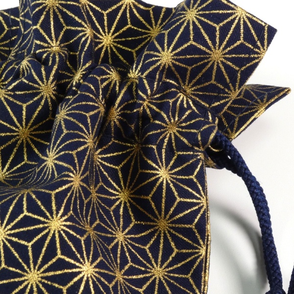Close up of drawstring top of dark blue hemp leaf design fabric bag