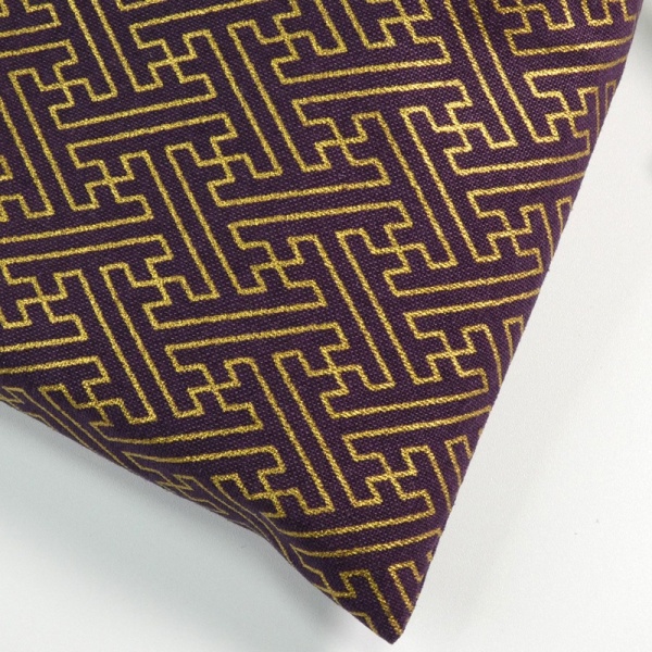 Close up of dark purple and gold geometric key design fabric bag