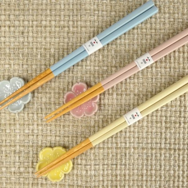 Pastel chopstick and chopstick rest sets in pastel pink, yellow and blue on a table