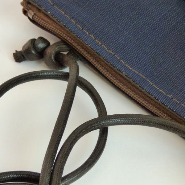 Close up of indigo blue handbag with Camellia flower design