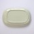 Underside of oval Japanese ceramic plate with yellow dipped glaze design