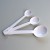 Set of three white enamel measuring spoons