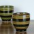 Black Japanese tea cup with red stripe pattern
