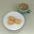 White daisy plate with blue Celadon-glaze mug