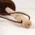 Close up of Tawashi washing up brush showing wooden handle