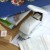 Harinacs white staple free stapler on desk