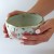 Sakura tea bowl held in hands