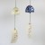 Arabesque and Summer Flowers wind chimes hanging side by side