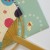 Close up of bamboo fan and envelope goldfish detail