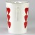 White handle of strawberry design enamelware jug