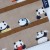 Close up of pandas reading and playing in the library