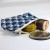 Small Fujiyama zip pouch holding sewing supplies