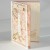 Intricate laser-cut greetings card with Japanese temari design showing inside illustration