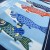 Close up detail of furoshiki wrapping cloth showing blue and red koi carp flags