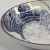 Close up of 'Great Wave' design on Japanese round plate