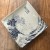 'Great Wave' blue and white Japanese square plate on table top
