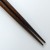 Pointed ends of dark wood Japanese chopsticks