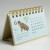 2026 mini Japanese desk calendar standing on desk - June wild cat