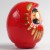 Side view of 11.5cm tall red Daruma figurine