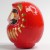 Side view of 11.5cm tall red Daruma figurine