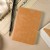 Ro-biki Texture Series Japanese notebook on a desk with brush pen and Japanese calligraphy