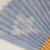Close up of pale blue reverse side of Japanese paper fan