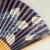 Close up of blue and white hydrangea design of Japanese paper fan