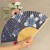 Blue and white hydrangea pattern Japanese folding fan held in a hand
