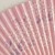Close up of pale pink sakura cherry blossom design on Japanese fan