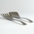 Curved profile of Japanese hammered metal serving utensils