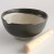 Black extra large Japanese suribachi next to wooden surikogi pestle